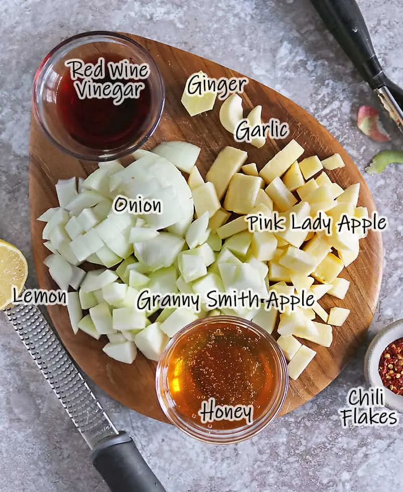 ingredients to make this apple chutney on a cutting board