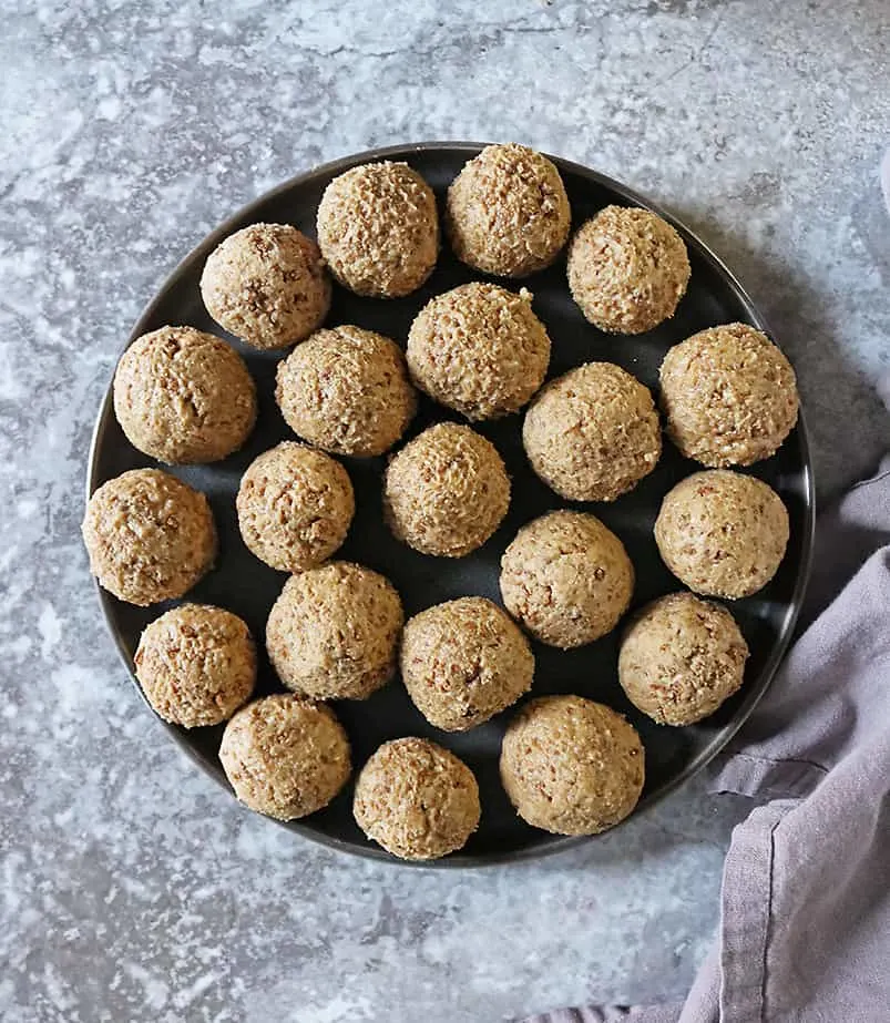 a plate of rolled crunchy peanut butter balls