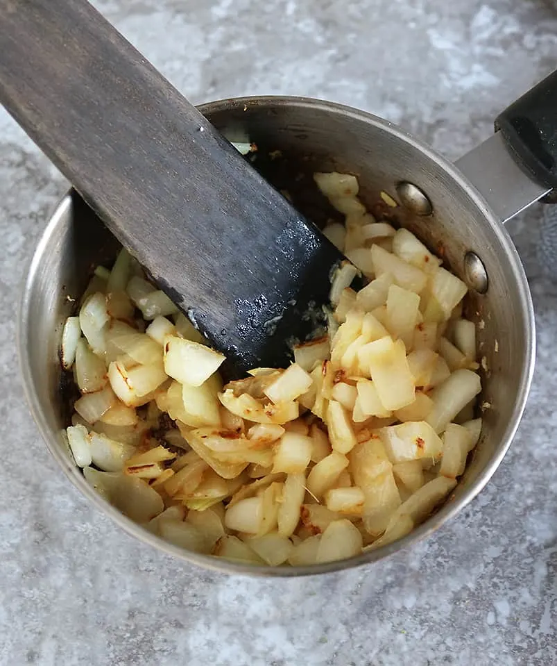 sauteing onions to make apple chutney