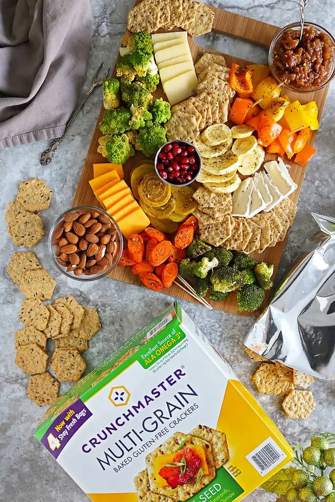 zaatar roasted veggies with Crunchmaster crackers and cheese on a platter