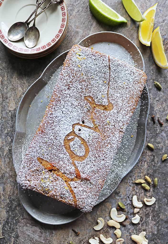 Delicious Eggless Cashew Semolina Cake AKA Love Cake with the word "love" on it in powdered sugar.