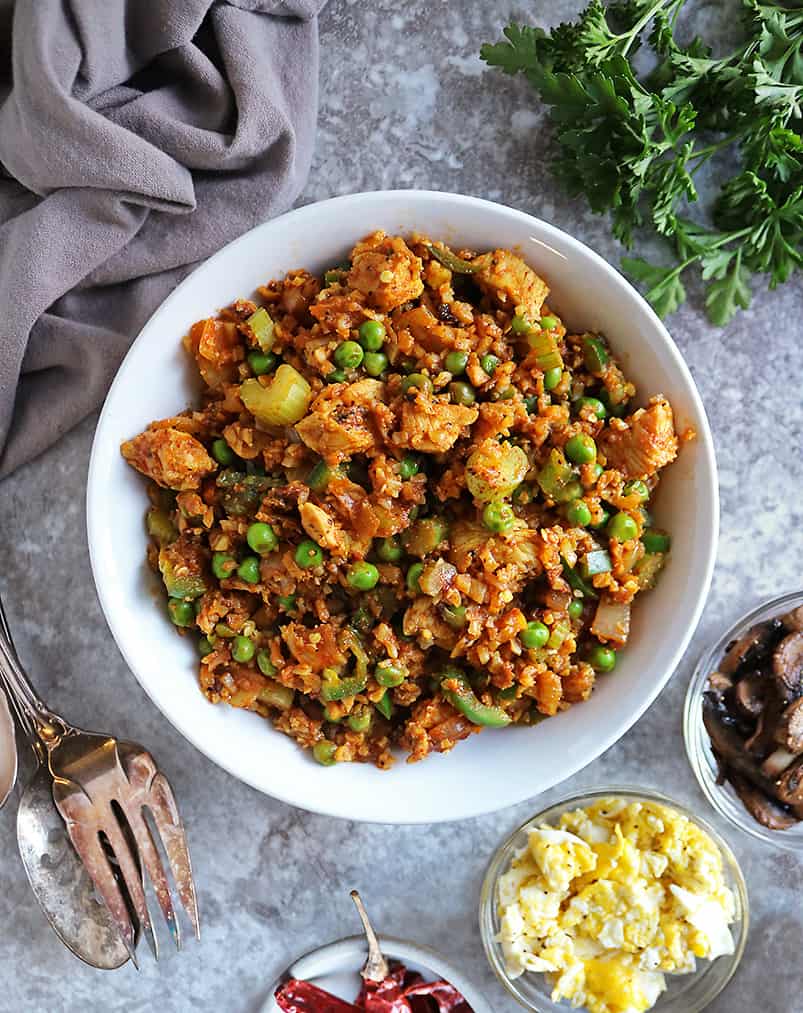 Easy Pan-Fried Chicken Cauliflower Rice Meal with toppings on the side.