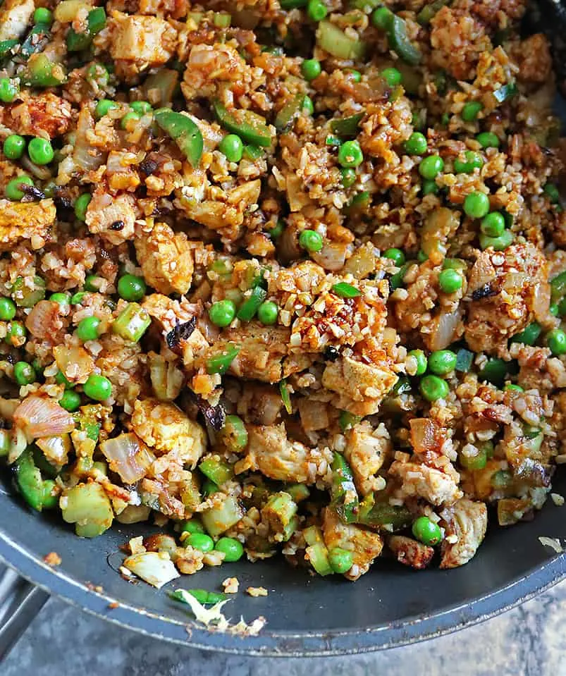 Making Fried Chicken Cauliflower Rice Meal in a large pan