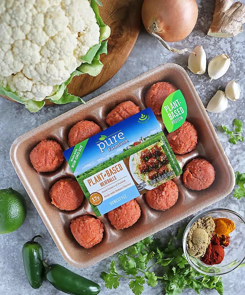 Pure Farmland Italian Style Plant Based Meatballs and ingredients to make Cauliflower Jalapeno sauce on grey background.