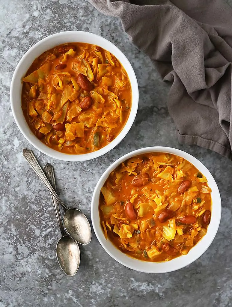 Delicious vegan melting cabbage soup in spiced coconut tomato broth