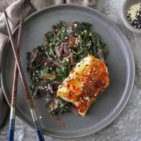 gray plate with Miso Glazed Cod with Spinach and Onions