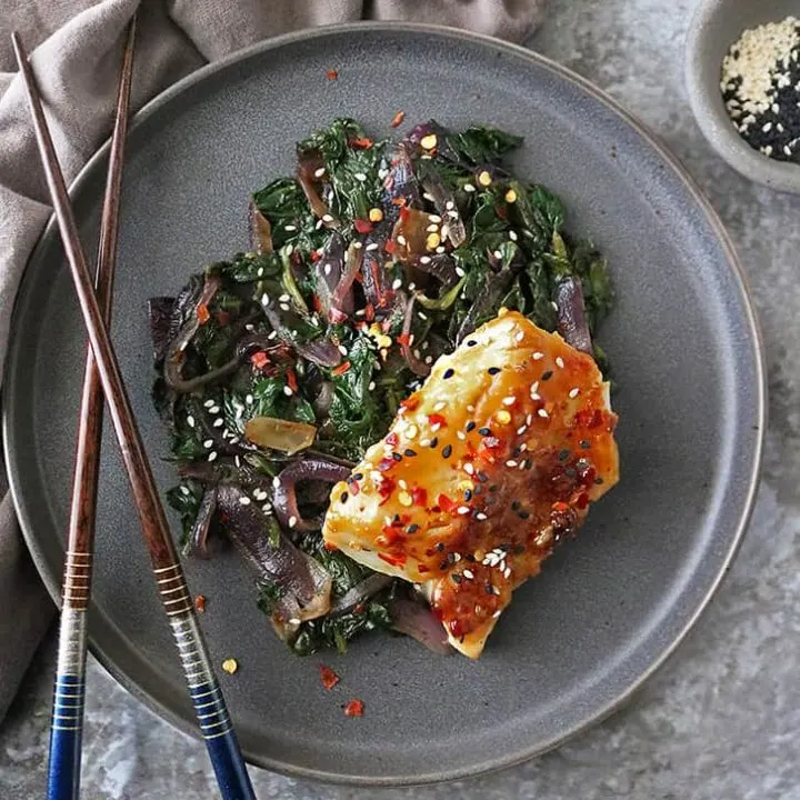 gray plate with Miso Glazed Cod with Spinach and Onions