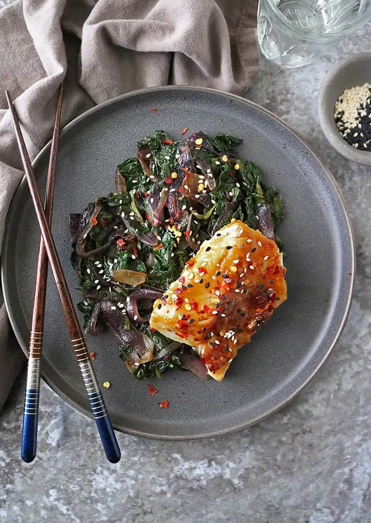 gray plate with Miso Glazed Cod with Spinach and Onions