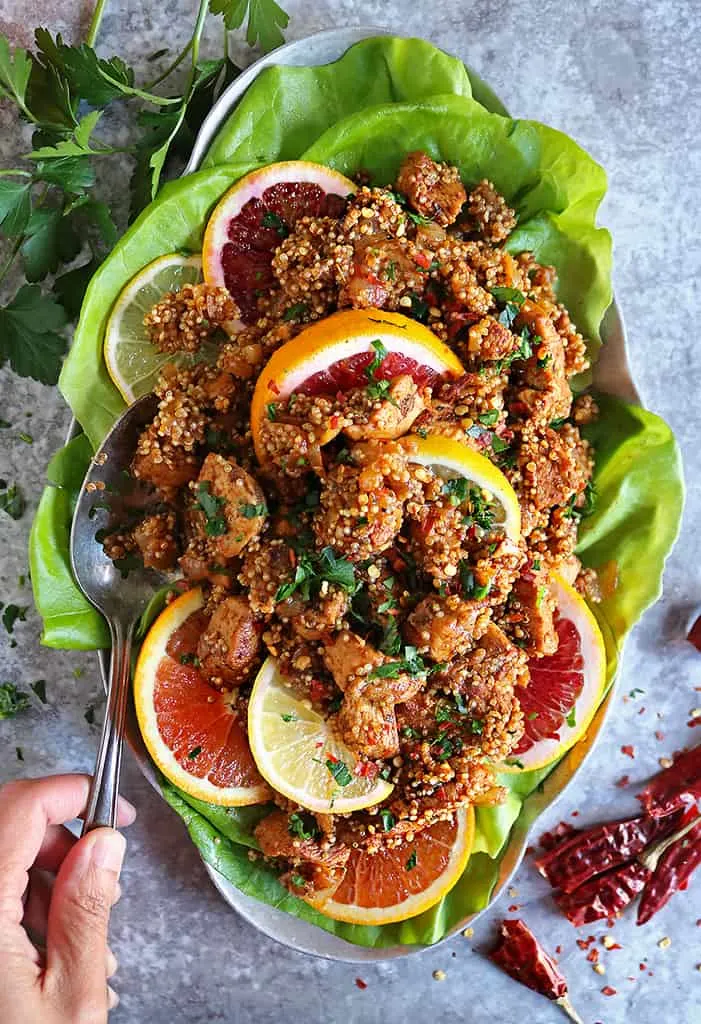 silver platter with citrus chicken quinoa dinner