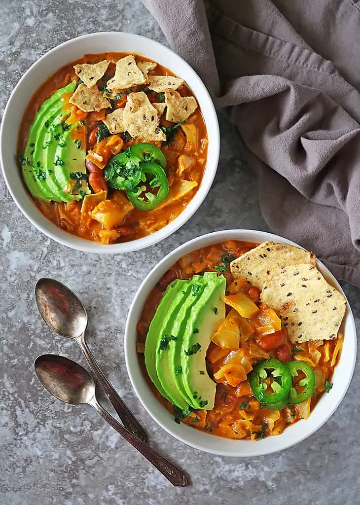 Two bowls of melt in your mouth vegan cabbage soup with beans.