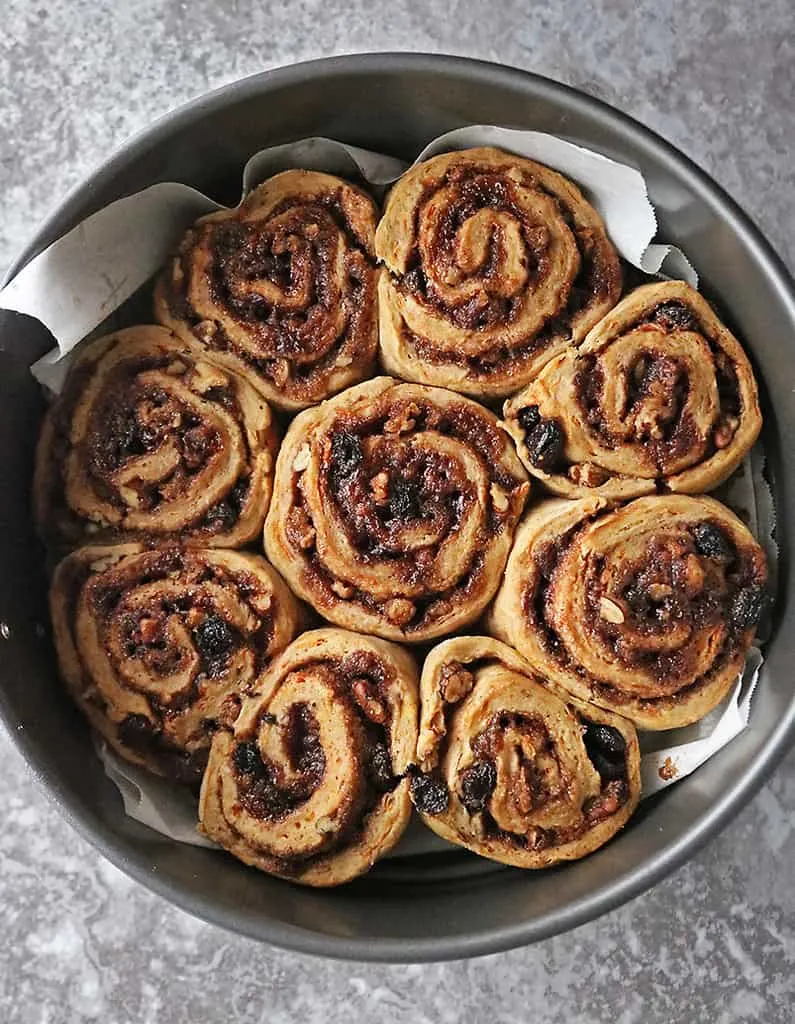 Overhead photo of Carrot cake cinnamon rolls just out of the oven.