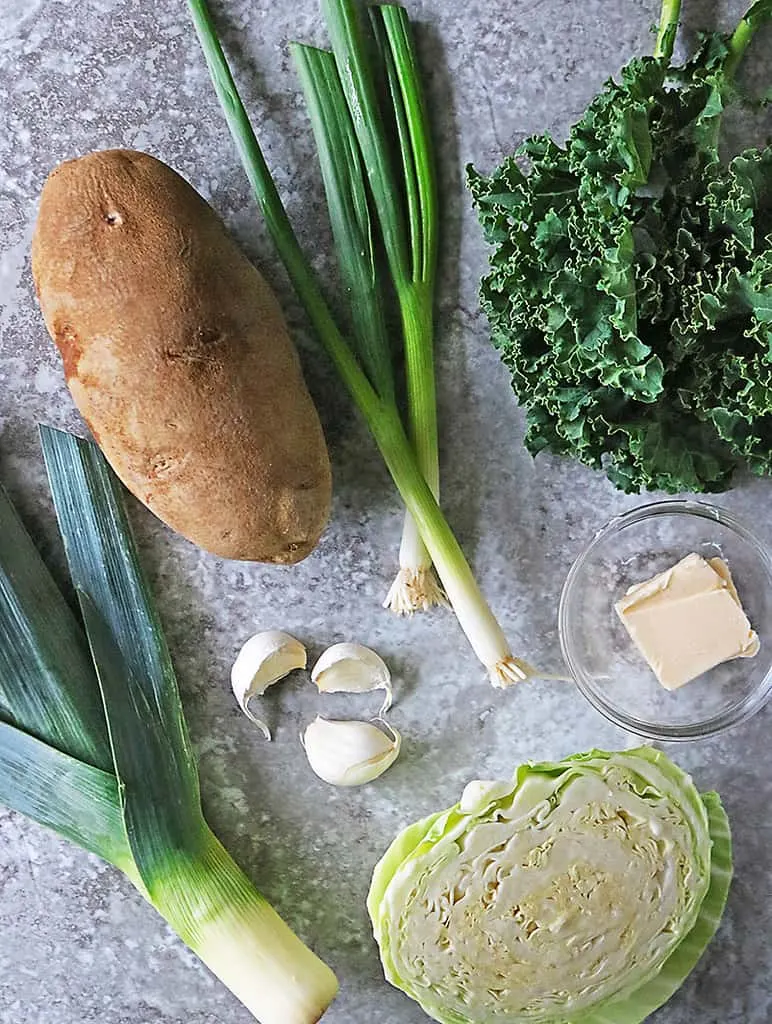 Ingredients to make Colconnan with a spin on a grey background.