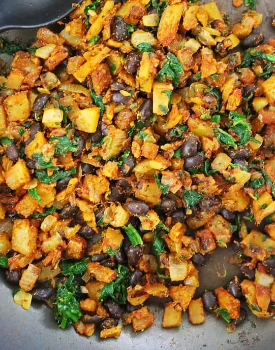 tasty vegan stuffing with potatoes, spinach, and beans.