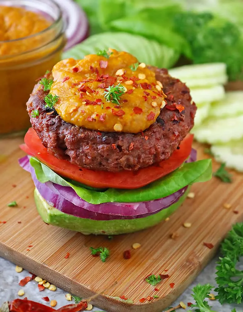 Delicious plant based Beyond Meat Burger on avocado with spicy mango sauce