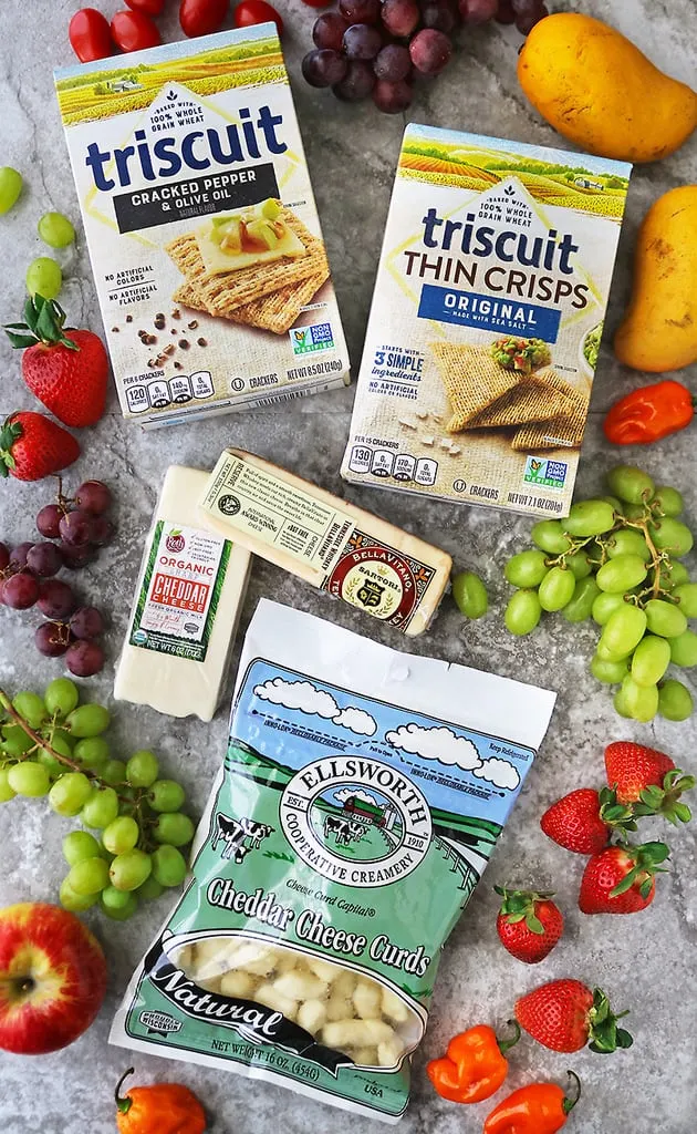 overhead photograph of Wisconsin Cheese varieties and triscuit crackers