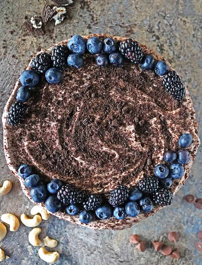 Overhead photo of Easy no-bake vegan chocolate treat with blackberries and blueberries on top