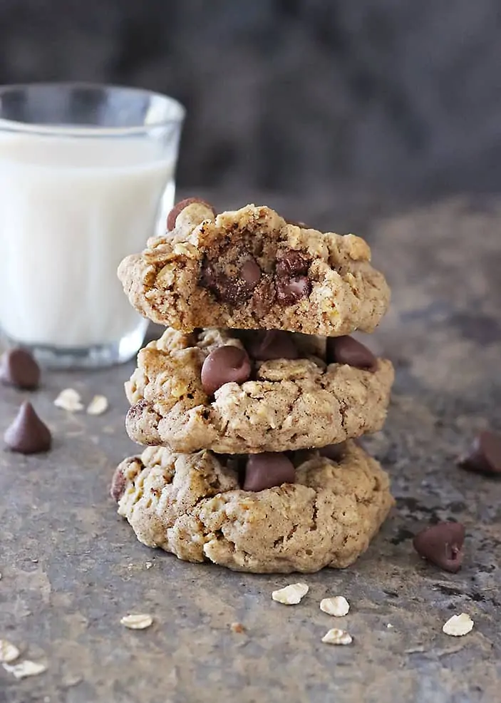 a stack of 3 of My favorite flourless oatmeal chocolate chip cookies - with a bite taken out of the top one.