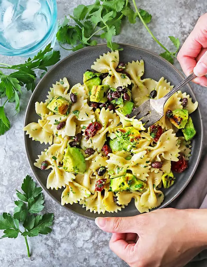 This Grilled Avocado Sundried Tomato Pasta Salad is an easy and quick meal that is incredibly flavorful thanks to grilled avocado and a lemon garlic herb dressing. 