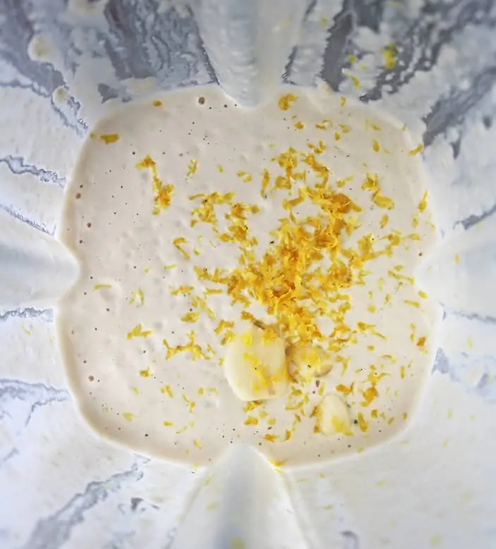 making cashew cream with garlic lemon zest cashews almondmilk maple syrup apple cider vinegar.