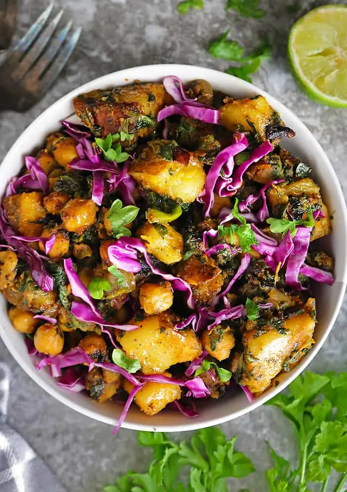 Enjoying a bowl of Chickpea Potato Spinach Sauté.