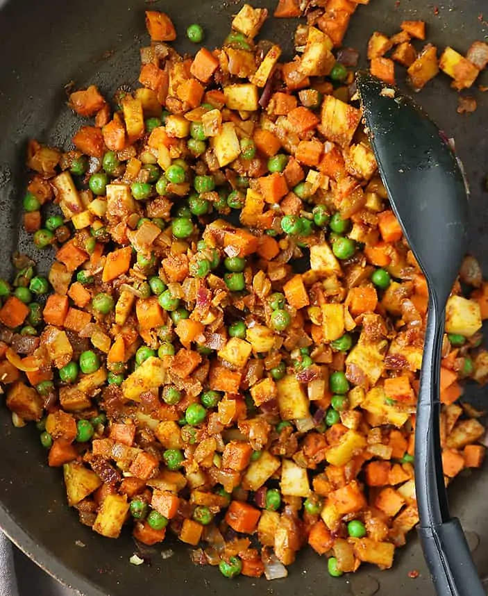 Making the veggie stuffing to stuff into puff pastry