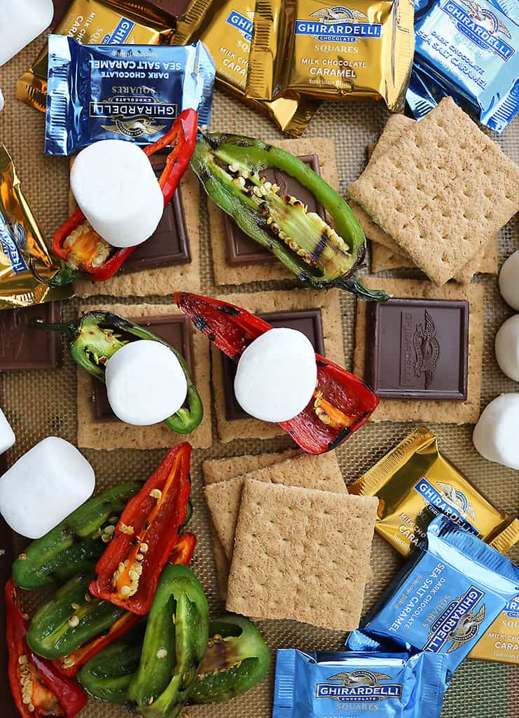 Baking tray with graham crackers, chocolate, roasted peppers and marshmallows