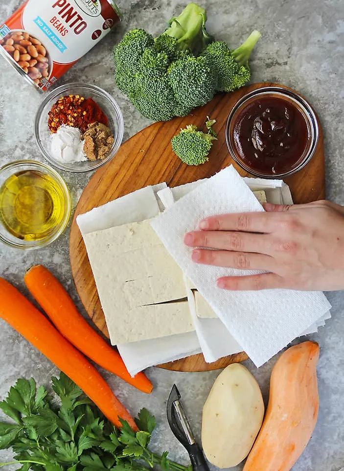 Drying tofu well before seasoning it.