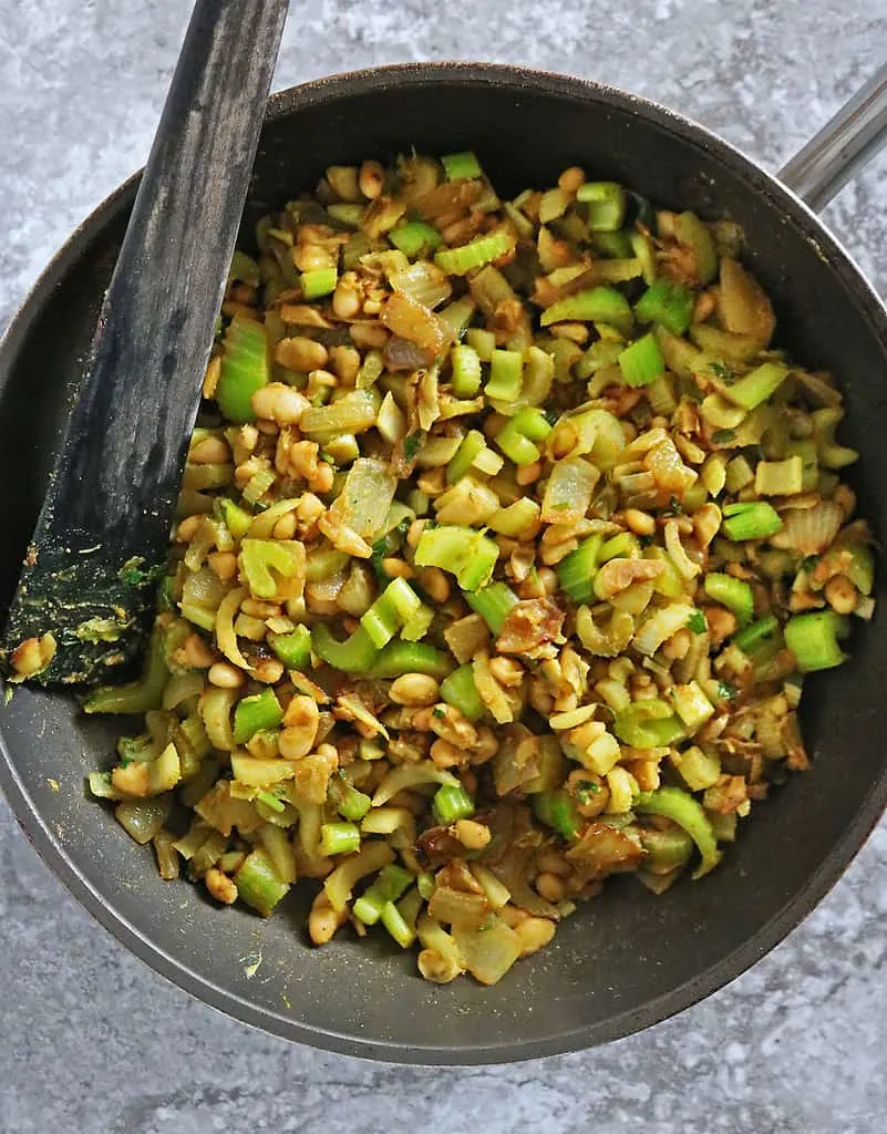 Sautéing ingredients together to make easy and delicious celery soup without potato