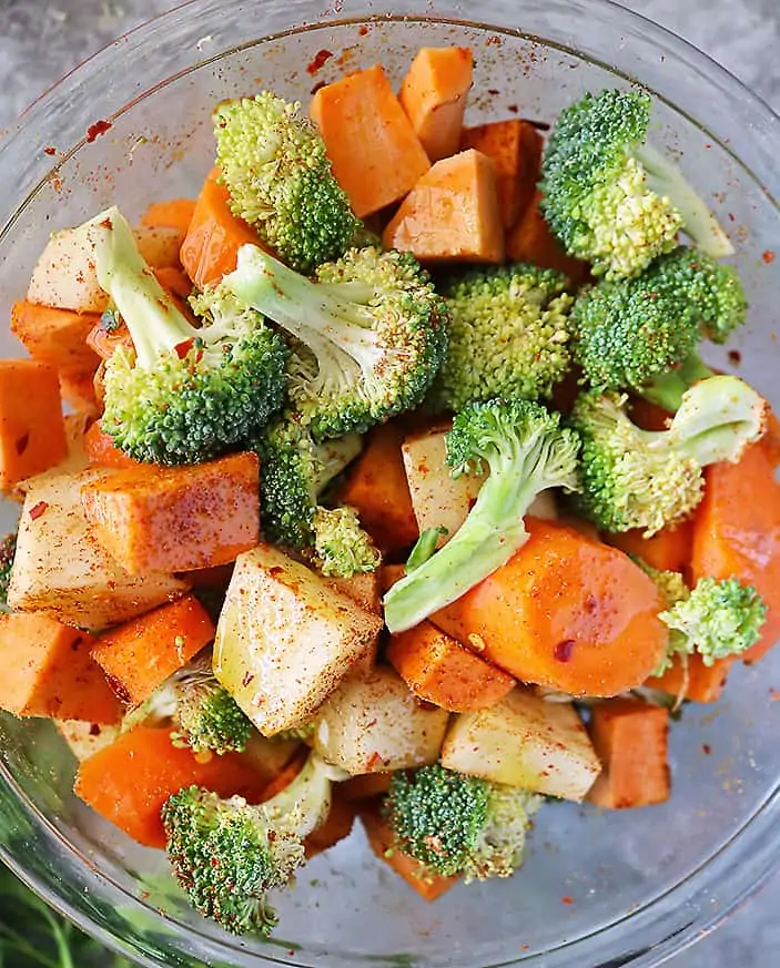 Veggies seasoned before baking.