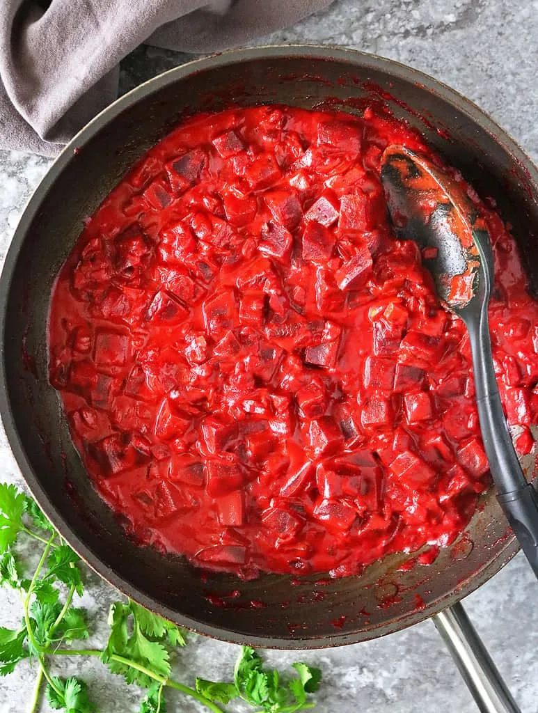 Making this tasty gory beet curry.