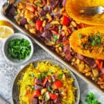 This Vegetarian Sheet Pan Dinner Recipe With Orangetti Squash is a delightful blend of colorful veggies and beans spiced with cayenne and Ras el Hanout. It is an easy and tasty meal that is ready in less than 40 minutes.