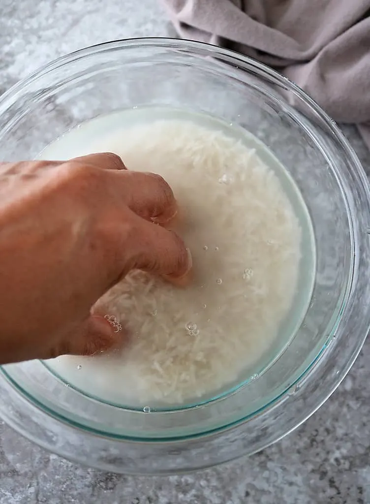 Washing the rice before using it.
