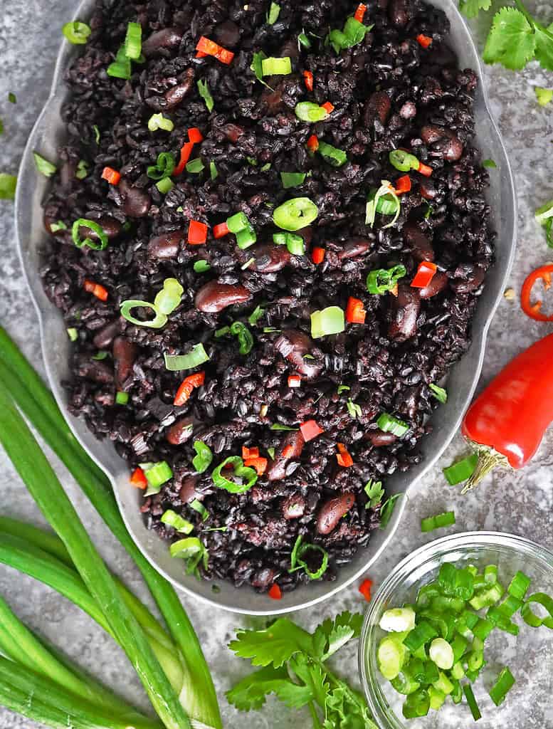 Easy Black Rice and Beans Recipe on a grey platter.