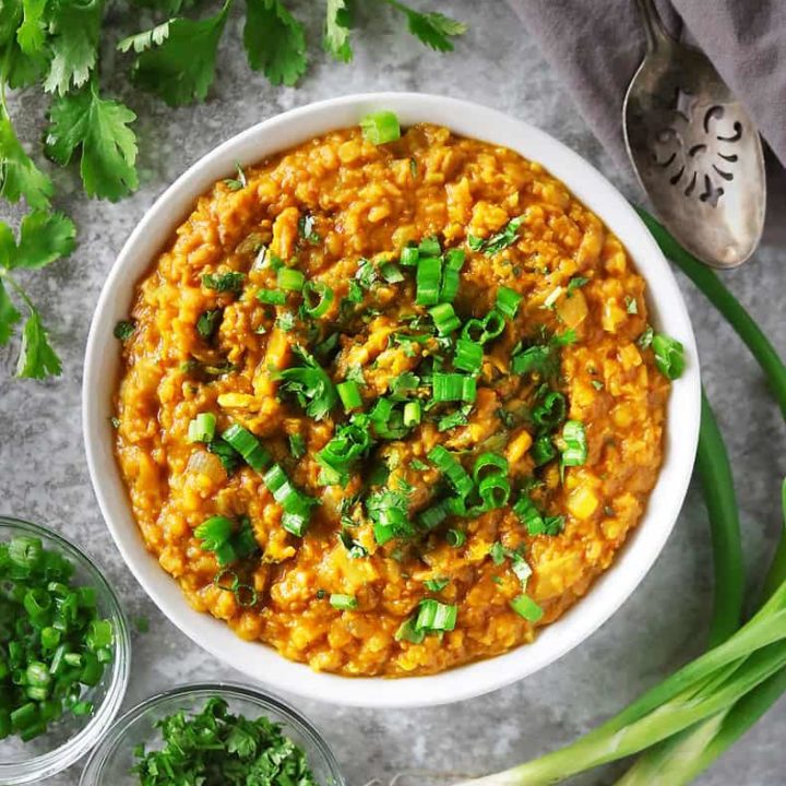 Easy tasty spicy pumpkin lentil curry made with dried lentils in a bowl.