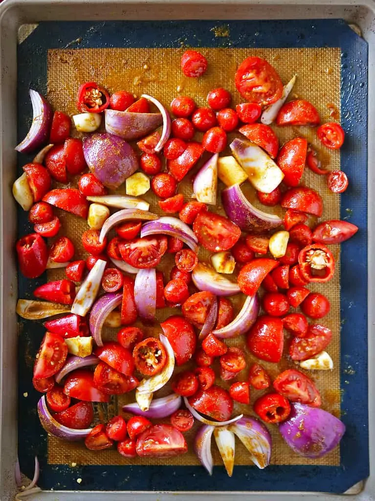 Preparing ingredients to roast on sheet pan