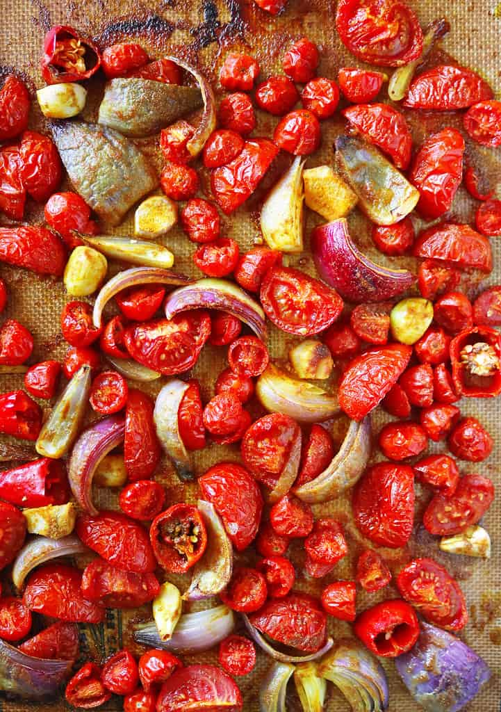 Sheet pan roasted tomatoes onions garlic ginger chili with spices