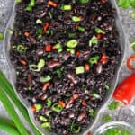This Black Rice And Beans Recipe is a spin on black beans and rice. It is an easy recipe in which nutty and nutritious black rice is cooked with kidney beans, ginger, garlic, onion, and celery.
