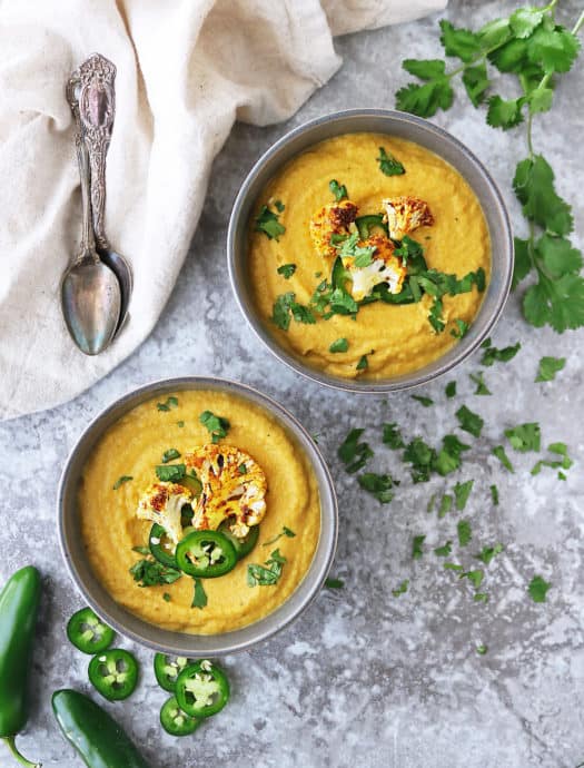 Two bowls with spicy cauliflower soup