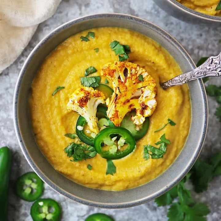 A big bowl of creamy plant based spicy cauliflower soup