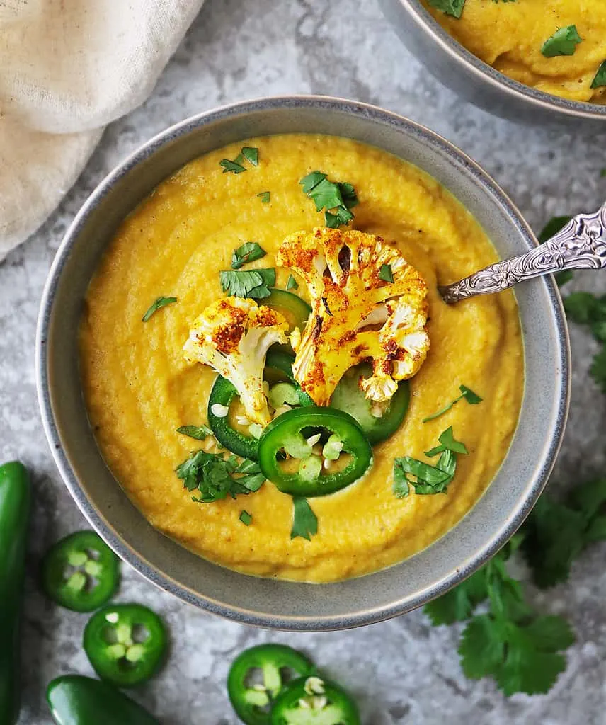 A big bowl of creamy plant based spicy cauliflower soup