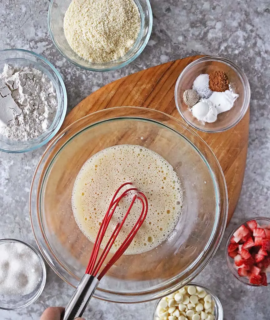 Mixing wet ingredients together to make Strawberry streusel Muffin Tops