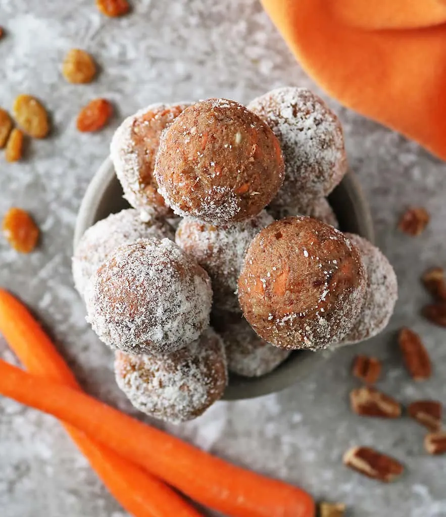 A Bowl of vegan carrot pecan bliss balls taken from overhead.