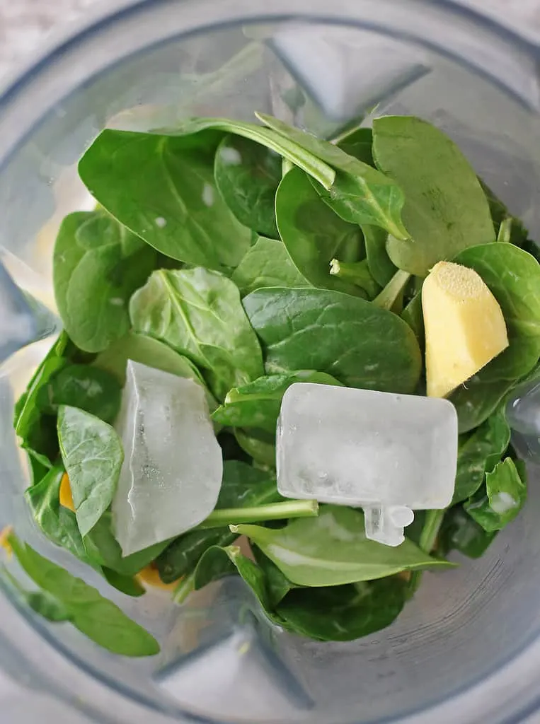 Making spinach pineapple smoothie in a good blender