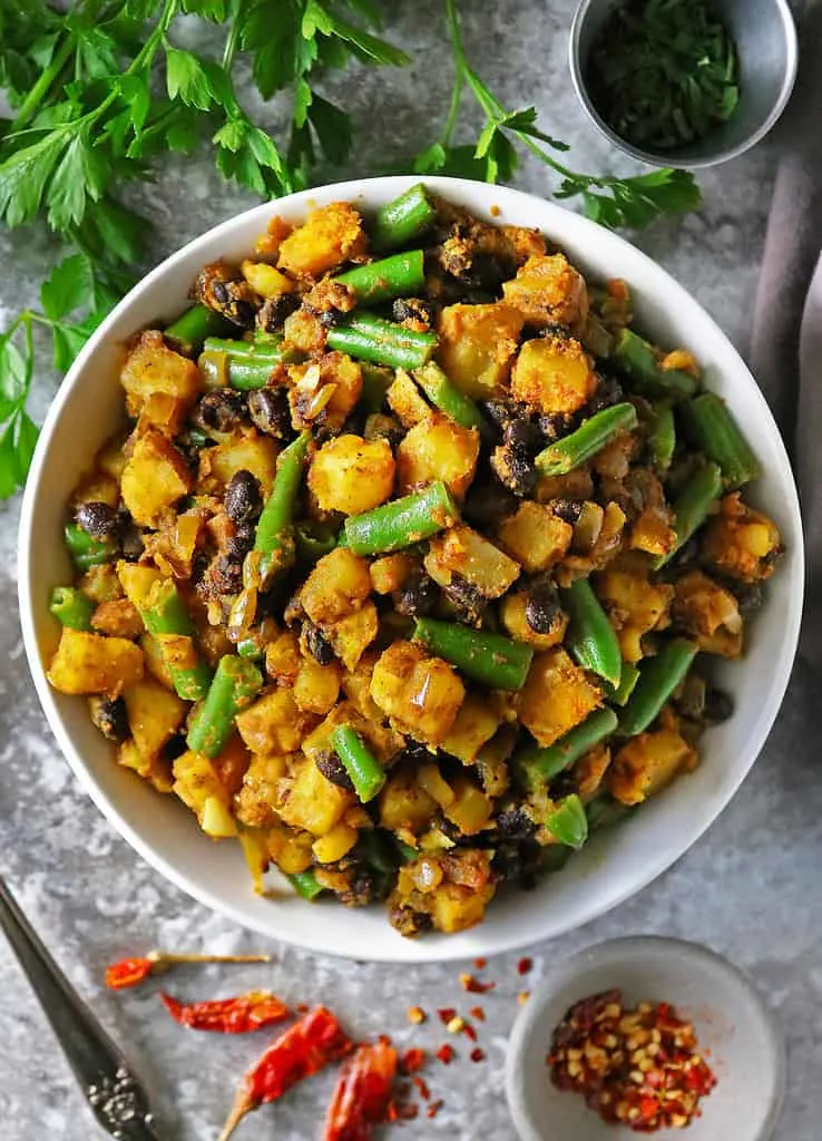 Vegan Green Beans And-Potatoes recipe in a large bowl on a gray background