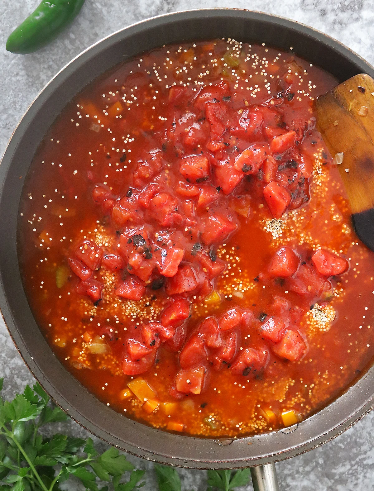 Cooking Quinoa in a tasty enchilada flavored broth with veggies