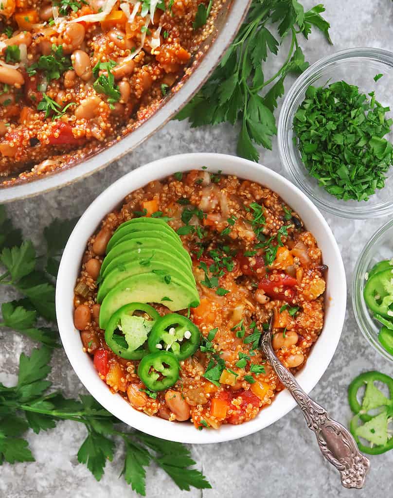 Enjoying a bowl of vegetarian enchilada quinoa with toppings