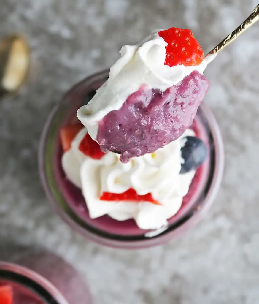 Taking a spoonful of sweet tasty vegan purple chia pudding