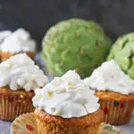 These artichoke cupcakes are spiced with cardamom, ginger, and cinnamon and topped with a creamy faux-cream cheese frosting.