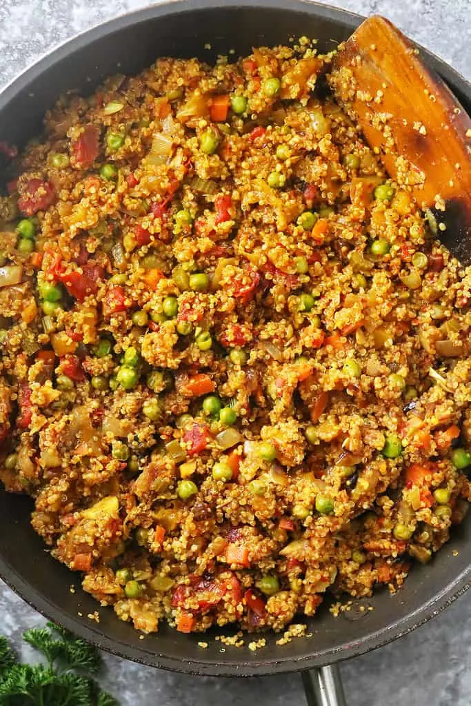 Making an easy vegetarian dinner of quinoa with mango