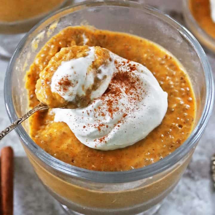 Taking a spoonful of a Healthy pumpkin spice chia pudding recipe